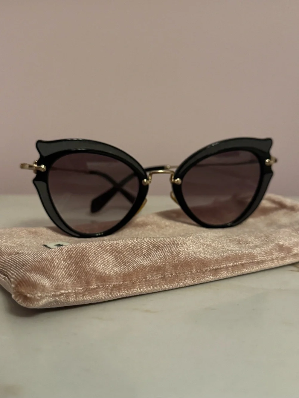 Miu Miu Black Cat-Eye Sunglasses with Gold Accents